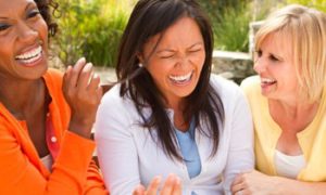 women-laughing-together